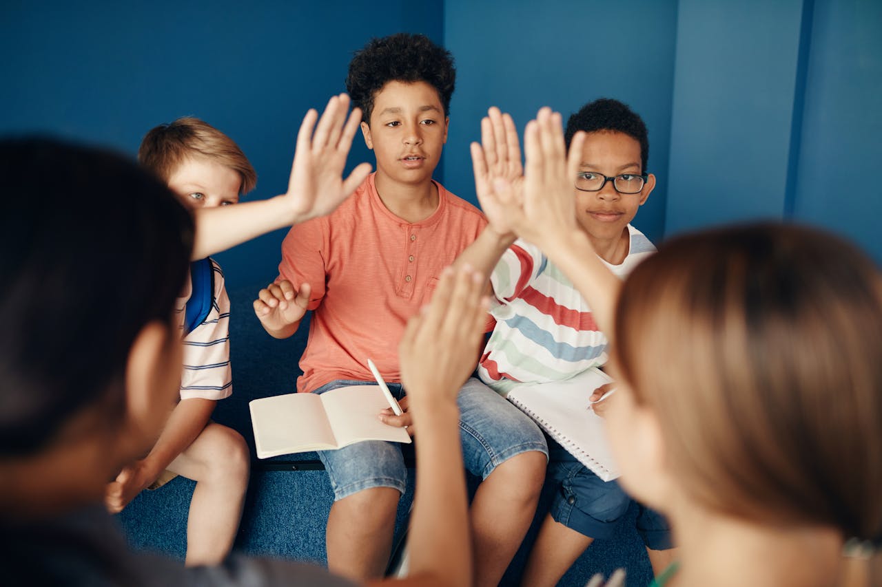 Group of diverse kids collaborating and learning together in a classroom setting.